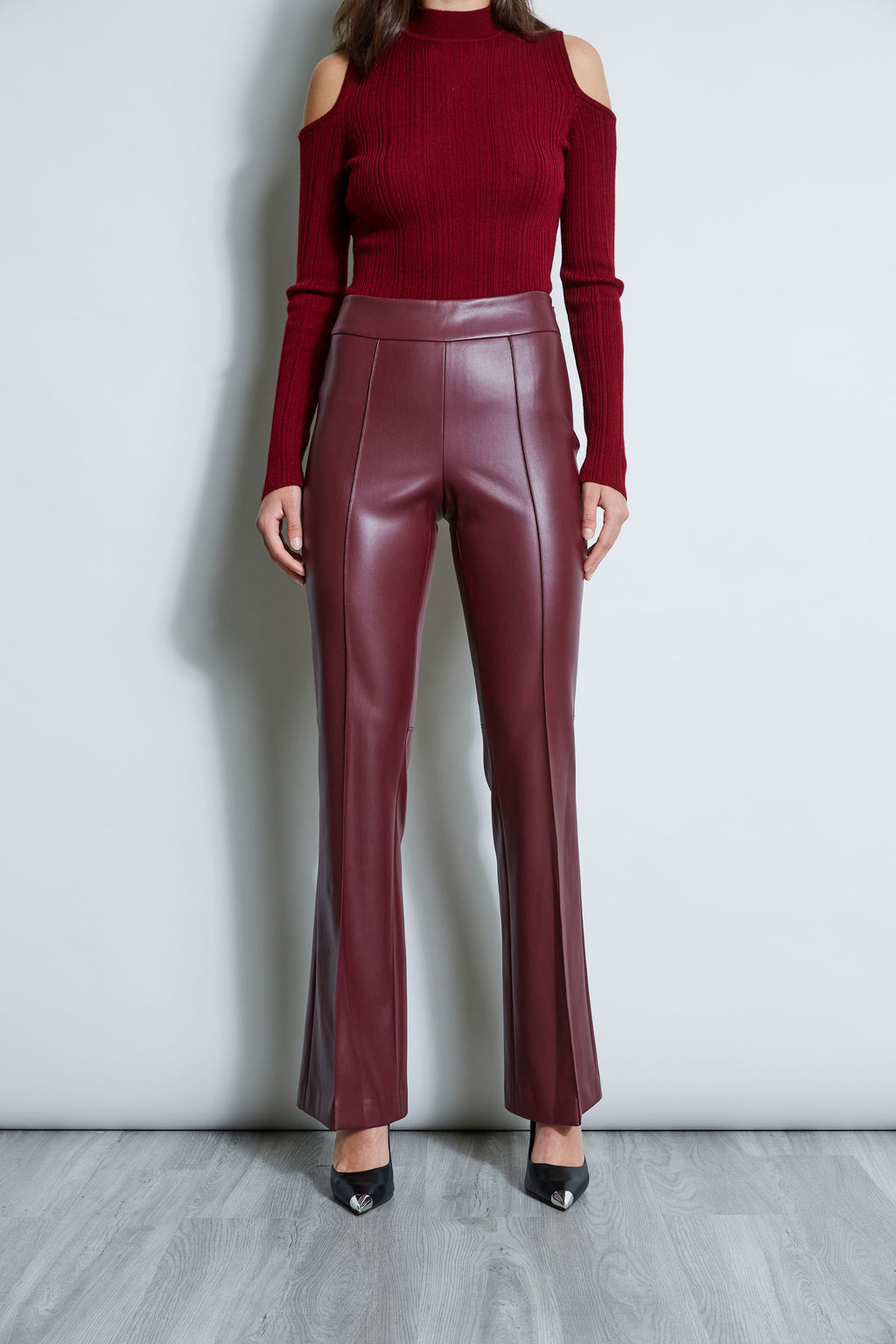 Eco-leather trousers with medium waist and flare leg with front